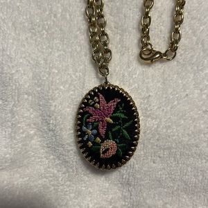 Vintage floral petit point pendant and 24”gold tone chain.